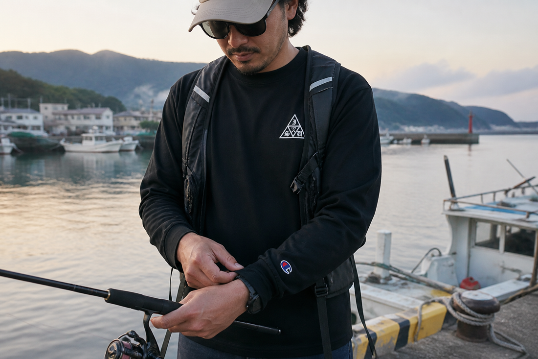 黒いSABIKI長袖シャツを着用した春秋の釣り